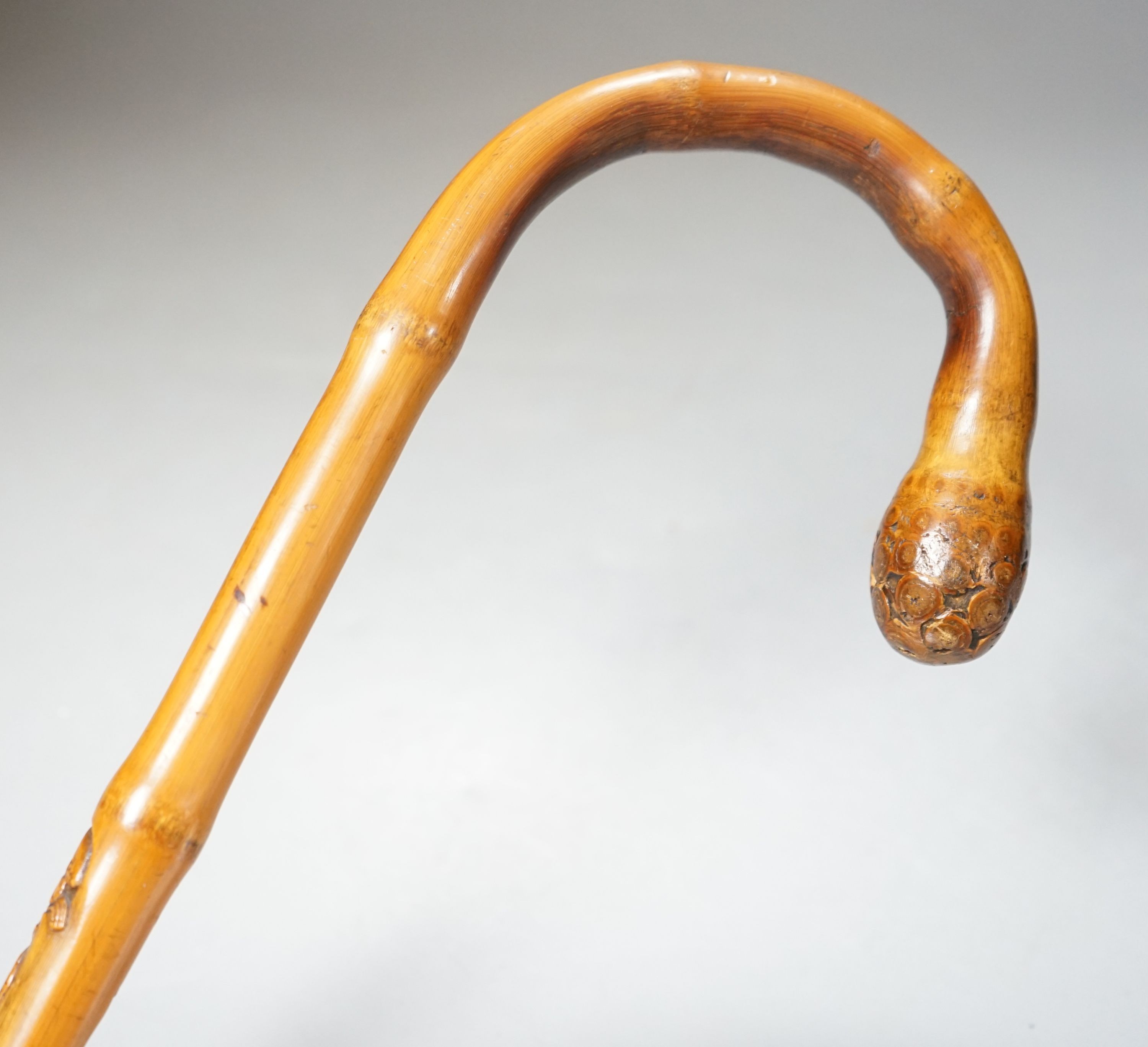 A Japanese bamboo 'monkey' walking cane, Meiji period 90cm